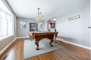 Prior to Virtual Staging, this living room was presented with a pool table in the center.